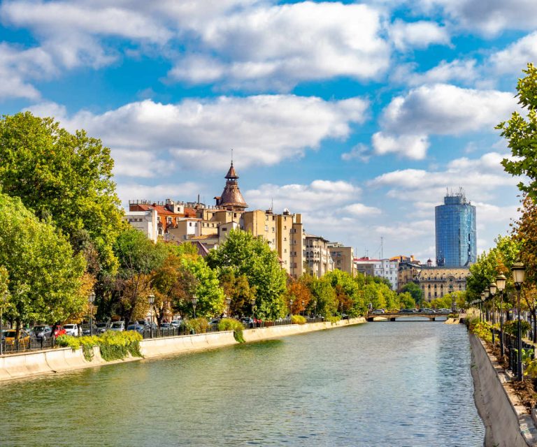 Dambovita river across the city of Bucharest in autumn season, R